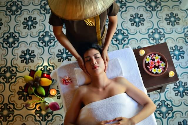 woman receiving a relaxing massage in a serene spa environment